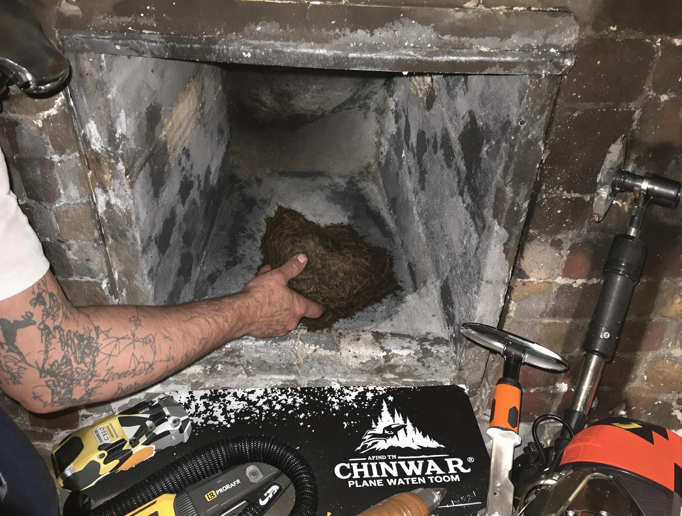 Vinings Chimney Sweep safely removing debris and screening chimney in Vinings, GA